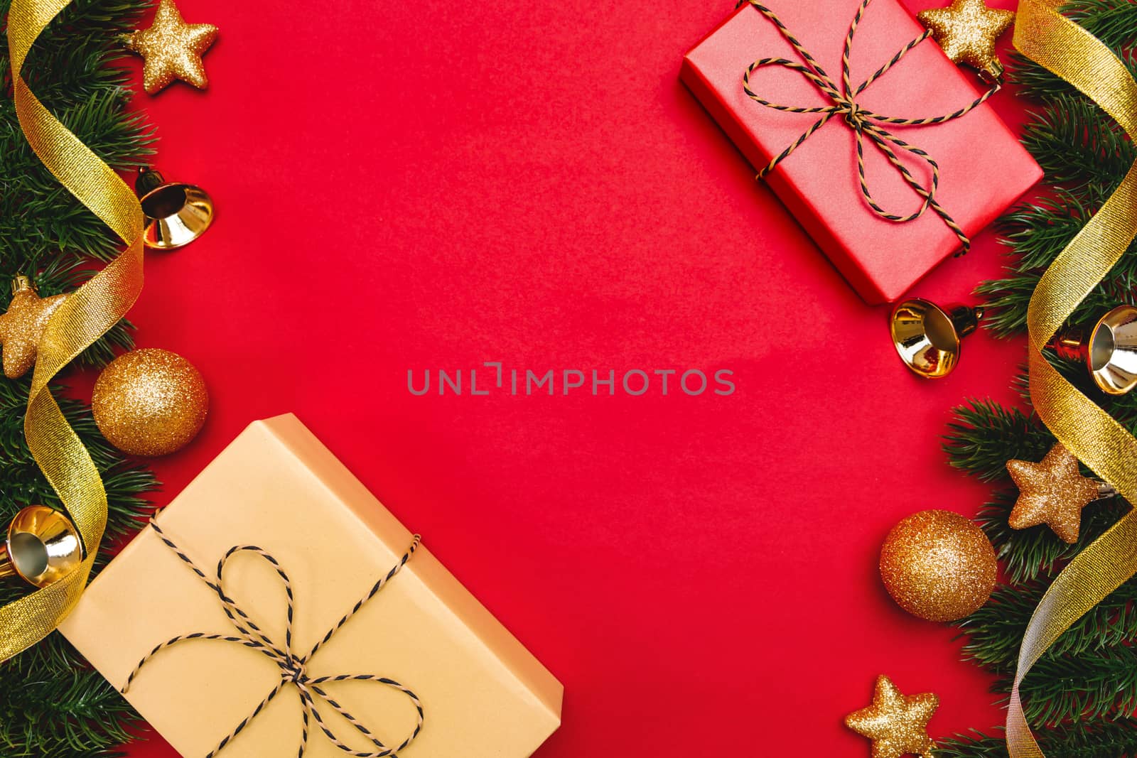 Christmas present and pine tree with xmas decoration on Red background