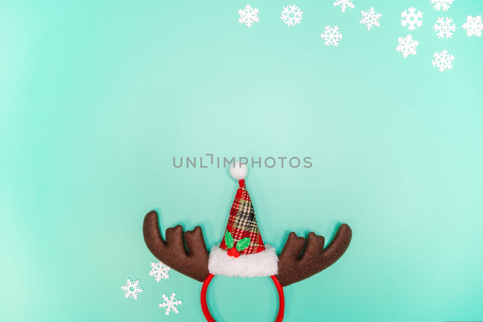 Christmas background concept. Top view of Christmas decoration, Santa Claus and reindeer on green background