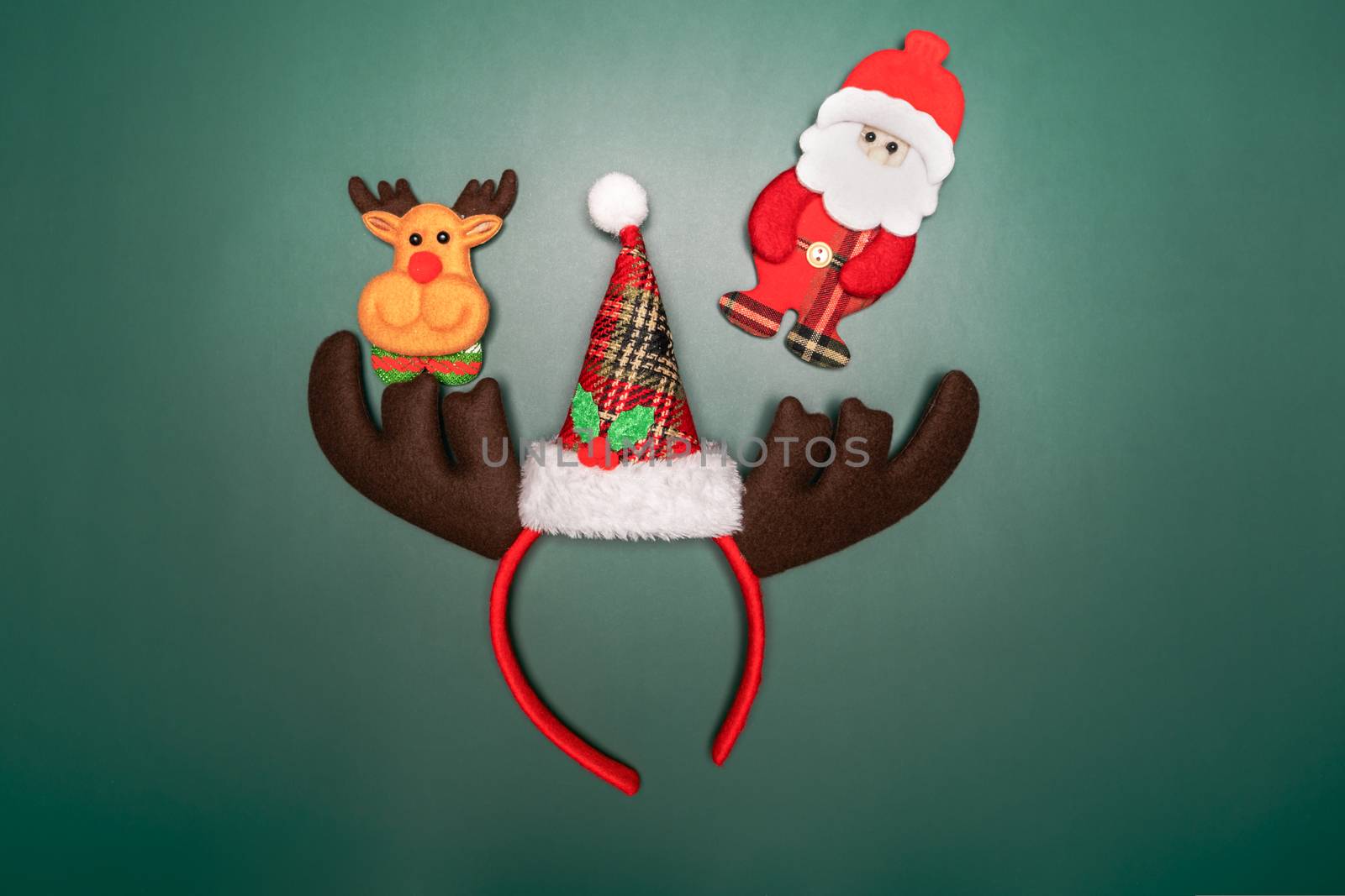Christmas background concept. Top view of Christmas gift box and decoration on green background