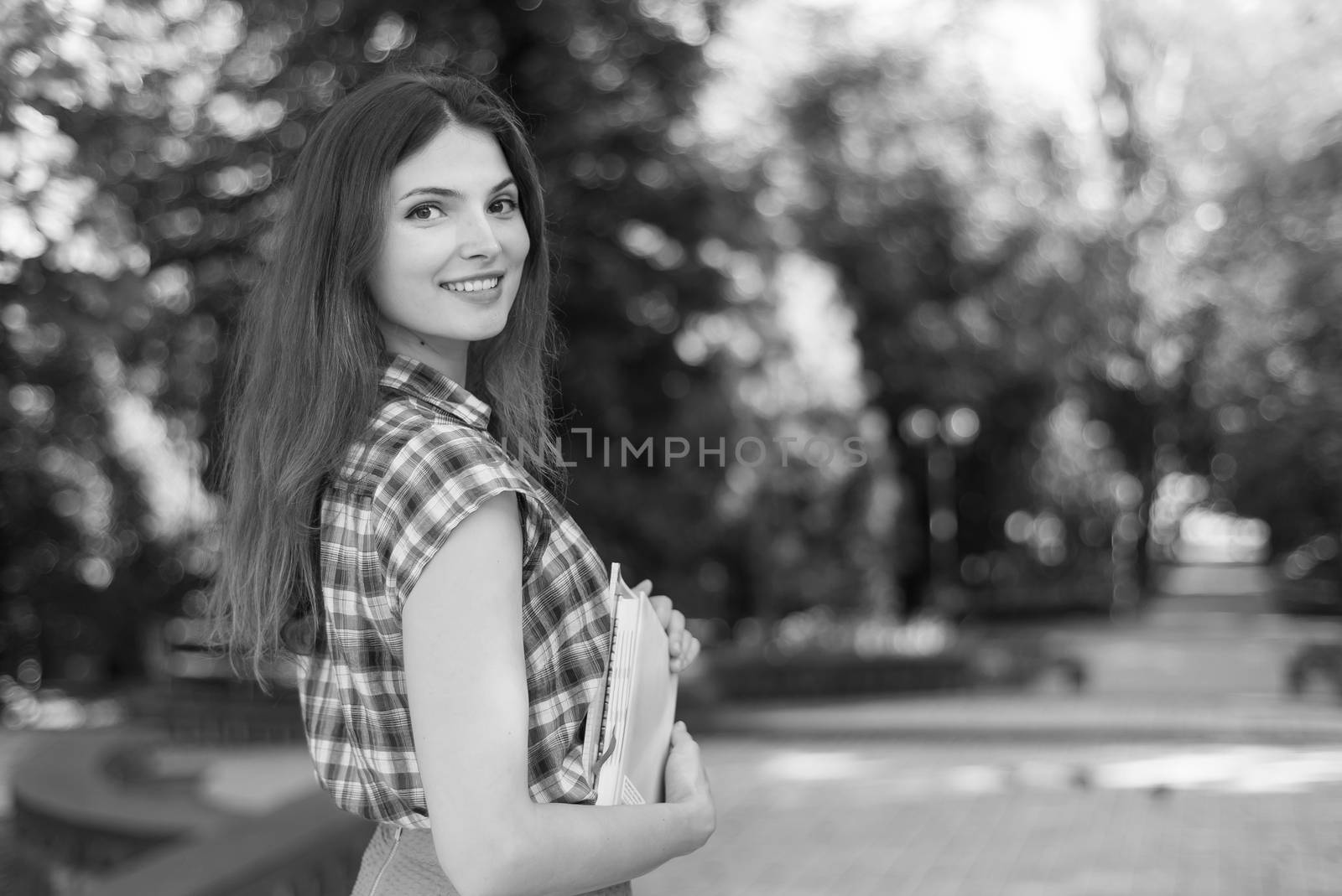 Girl student in skirt and plaid shirt. Kyiv. Ukraine