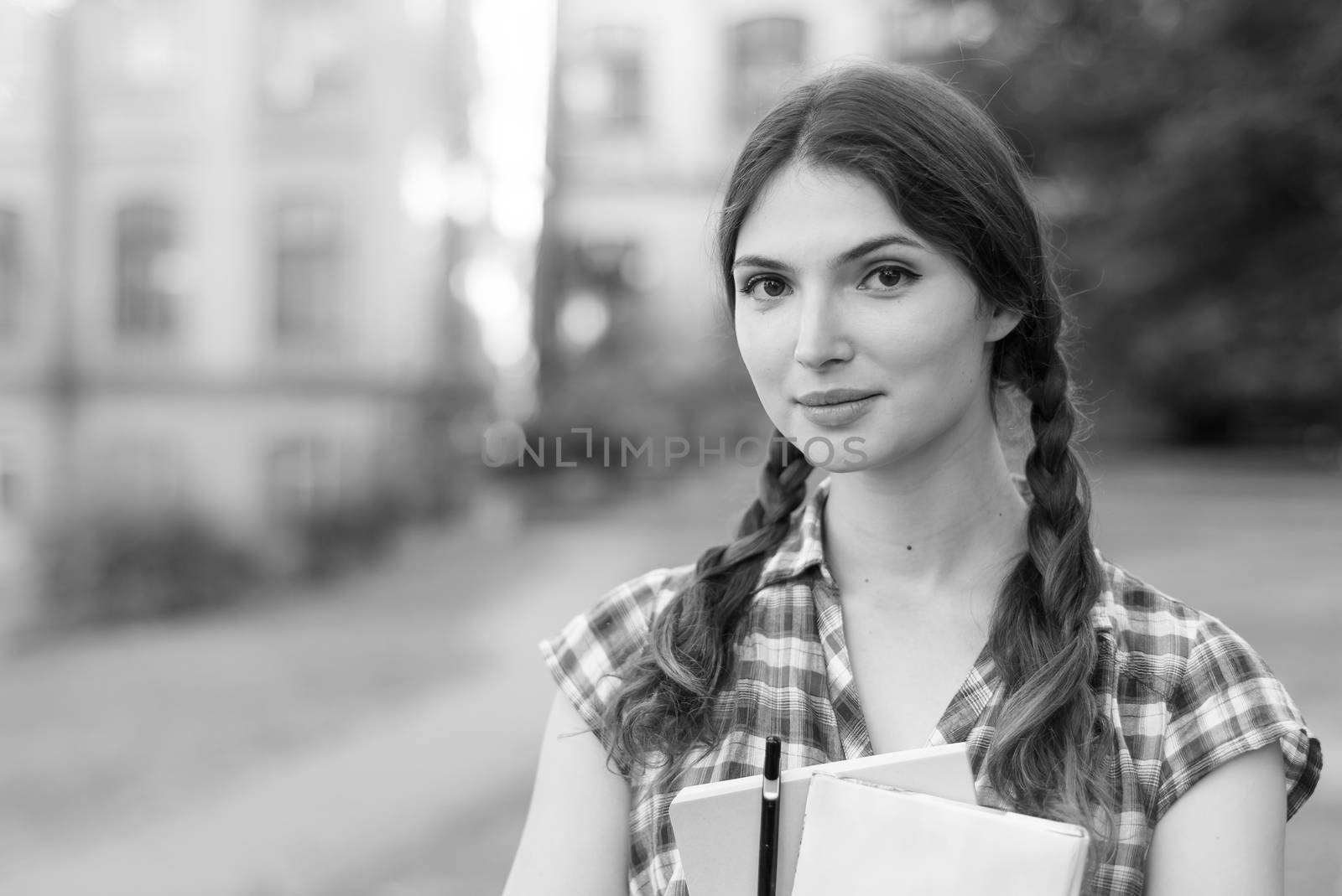 Girl student in skirt and plaid shirt. Black and white photo. BW by Mykola_Kondrashev