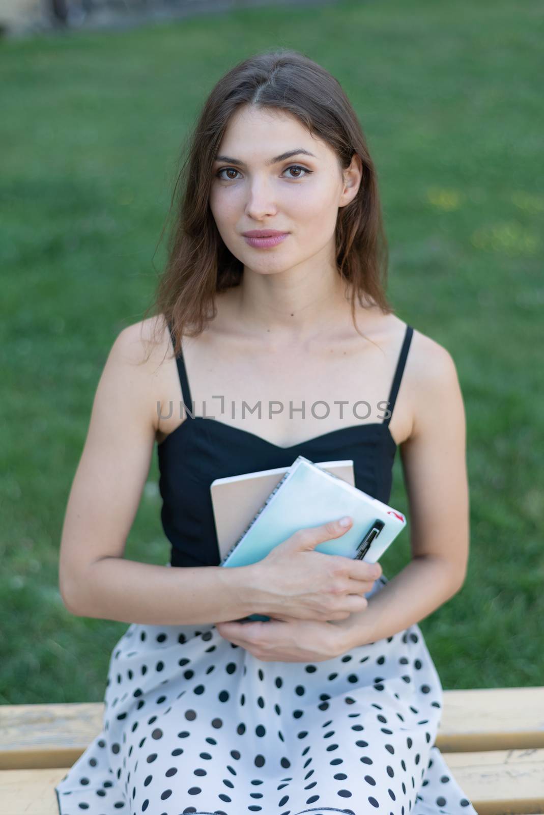 Girl student on a bench. Kyiv. Ukraine