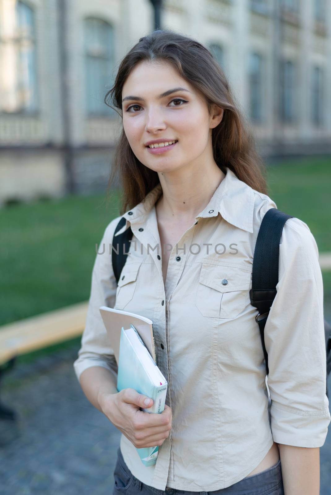 Young beautiful girl student in shirt by day by Mykola_Kondrashev