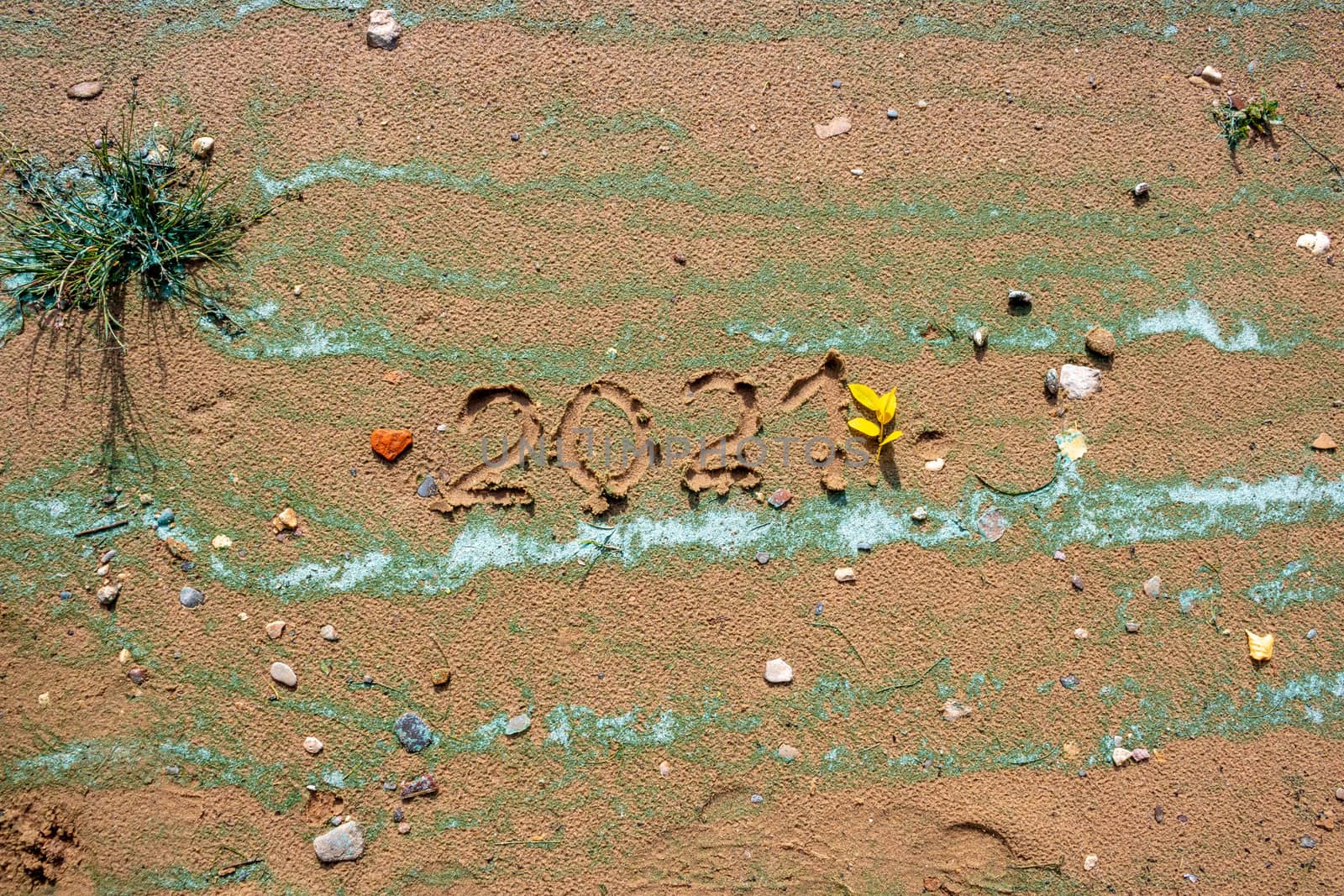 The concept of a New year. Heart and numbers 2021 in the sand. Summer beach holidays . The message is handwritten. by lapushka62