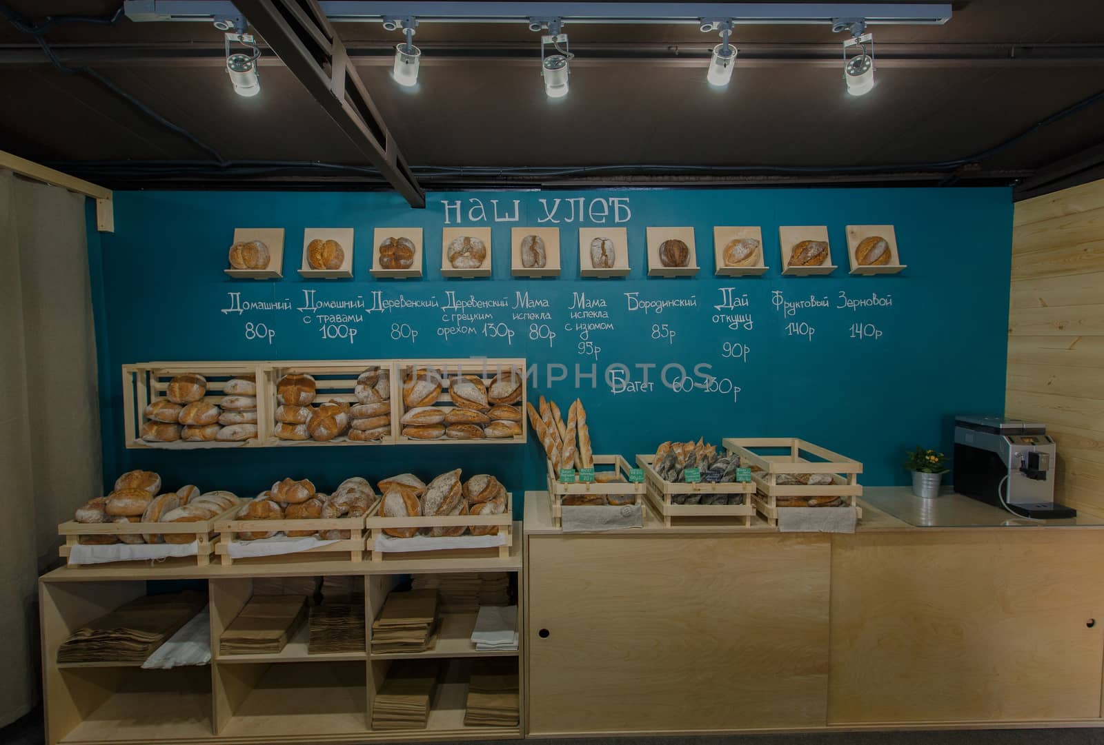 Fresh baked goods are beautifully arranged on display in wooden crates.