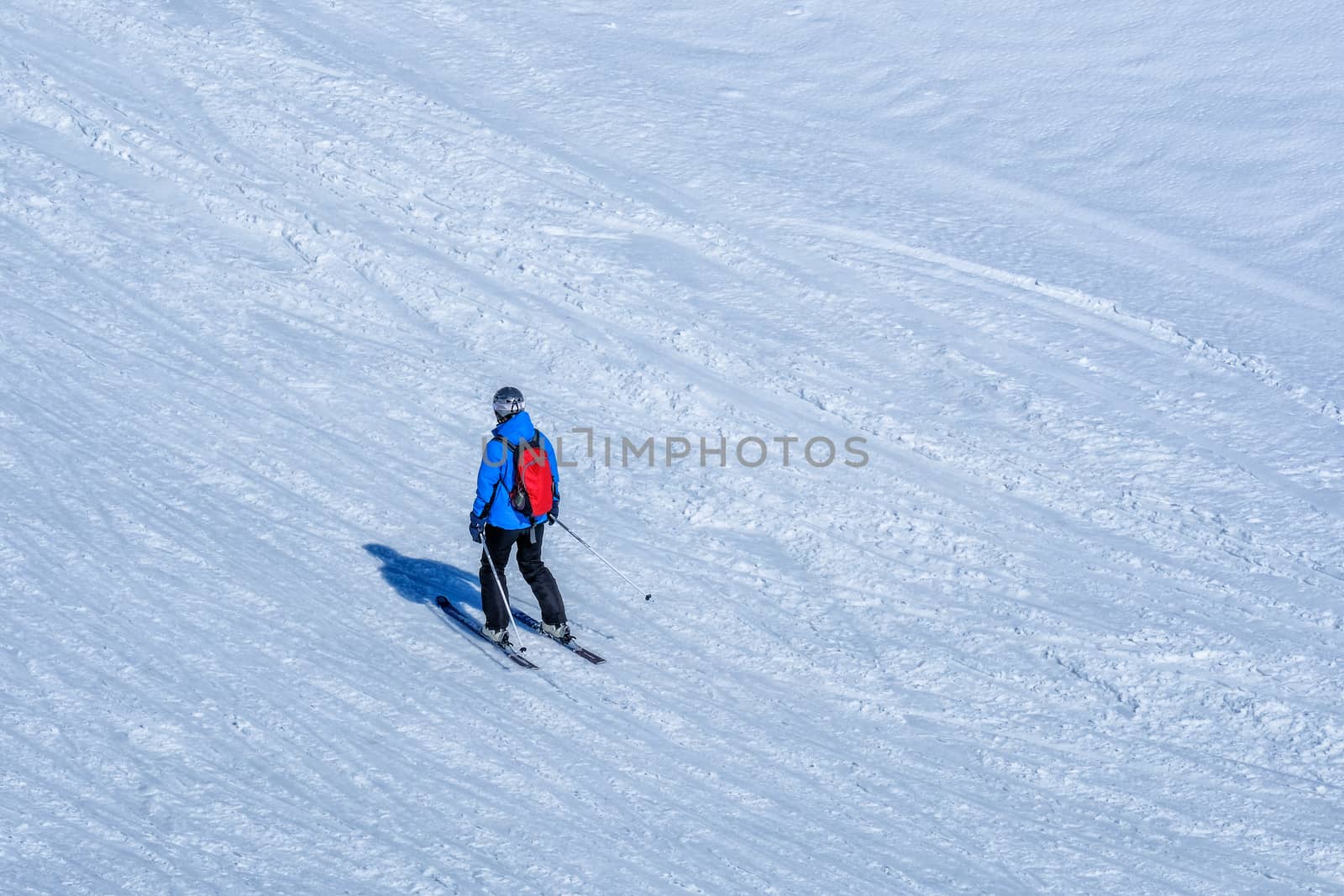 Skier skiing downhill in high mountains Kleine Scheidegg station by Surasak