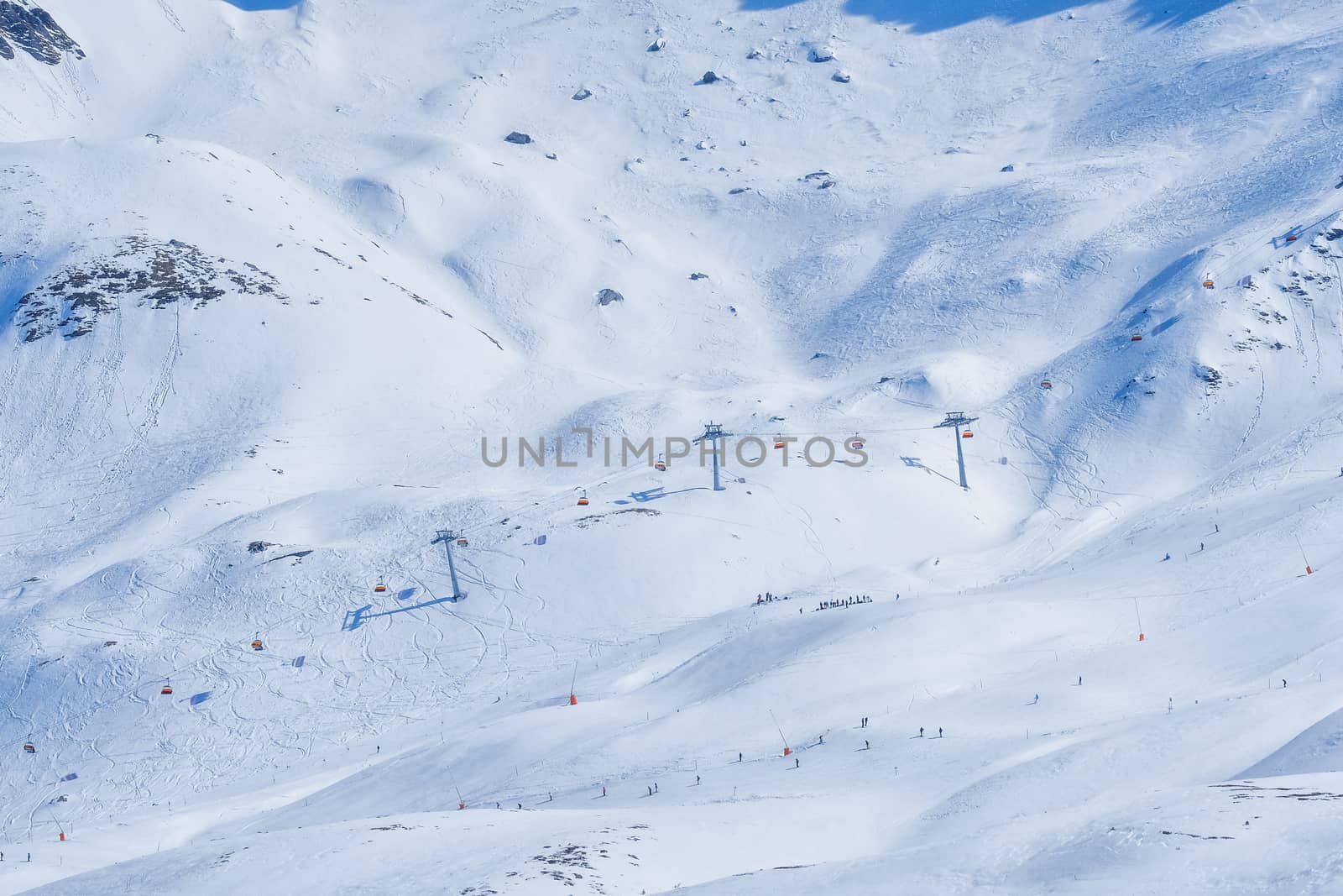 Panoramic view of ski chair lift in high mountains in Switzerlan by Surasak