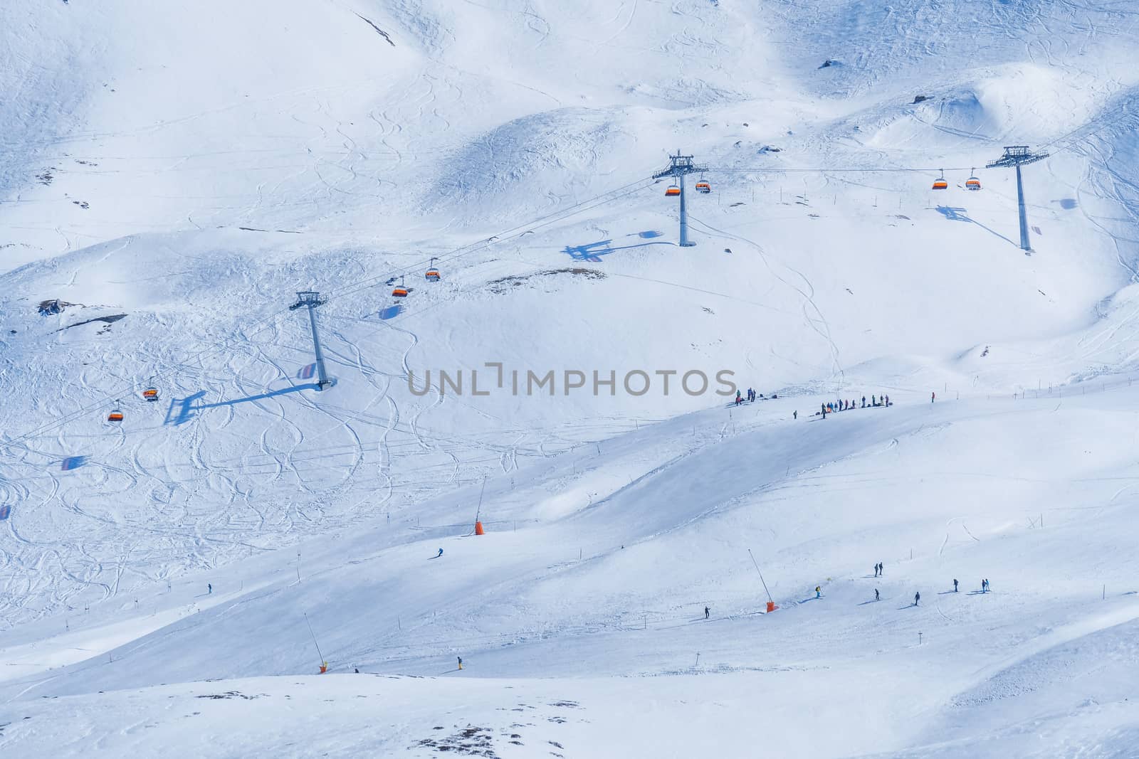 Panoramic view of ski chair lift in high mountains in Switzerlan by Surasak