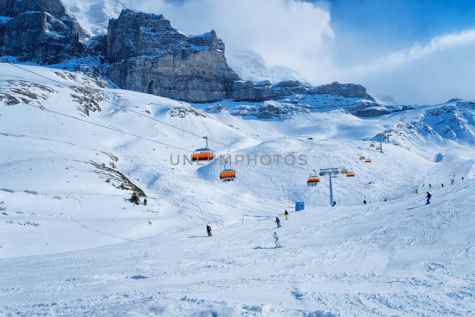 Panoramic view of ski chair lift in high mountains in Switzerlan by Surasak