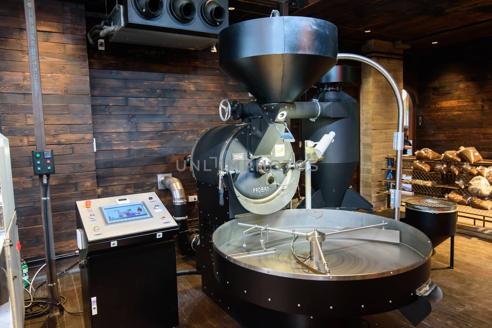 Bangkok, Thailand - 16 September, 2020:  A big of modern Coffee grinder in NANA Hunter Coffee Roasters coffee cafe