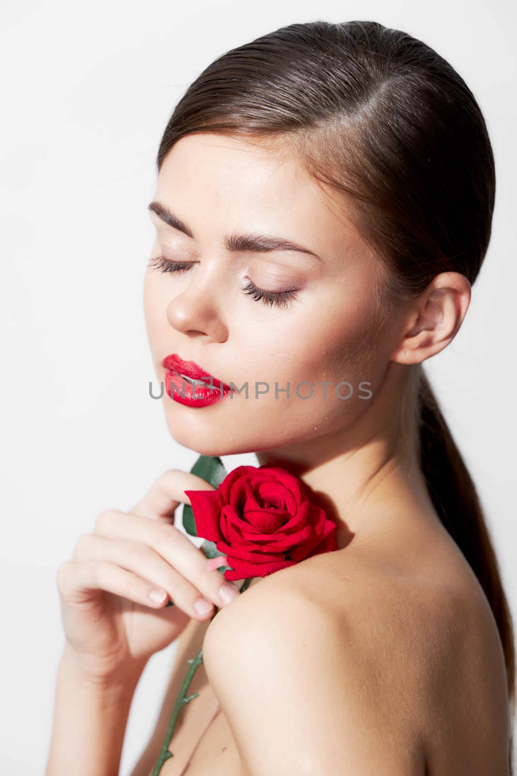 Lady with rose Eyes closed red lips model luxury background