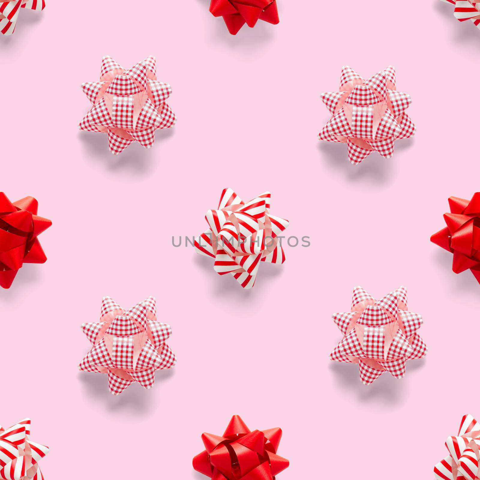 Seamless regular creative Christmas pattern with New Year decorations on pink background. xmas Modern Seamless pattern made from christmas decorations. Photo quality pattern for fabric, prints, wallpapers, banners or creative design works.