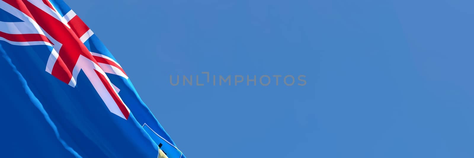 3D rendering of the national flag of Montserrat waving in the wind against a blue sky