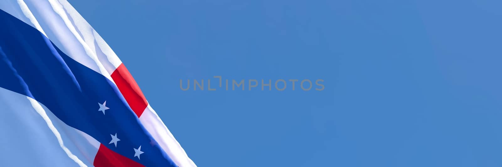 3D rendering of the national flag of Netherlands Antilles waving in the wind against a blue sky