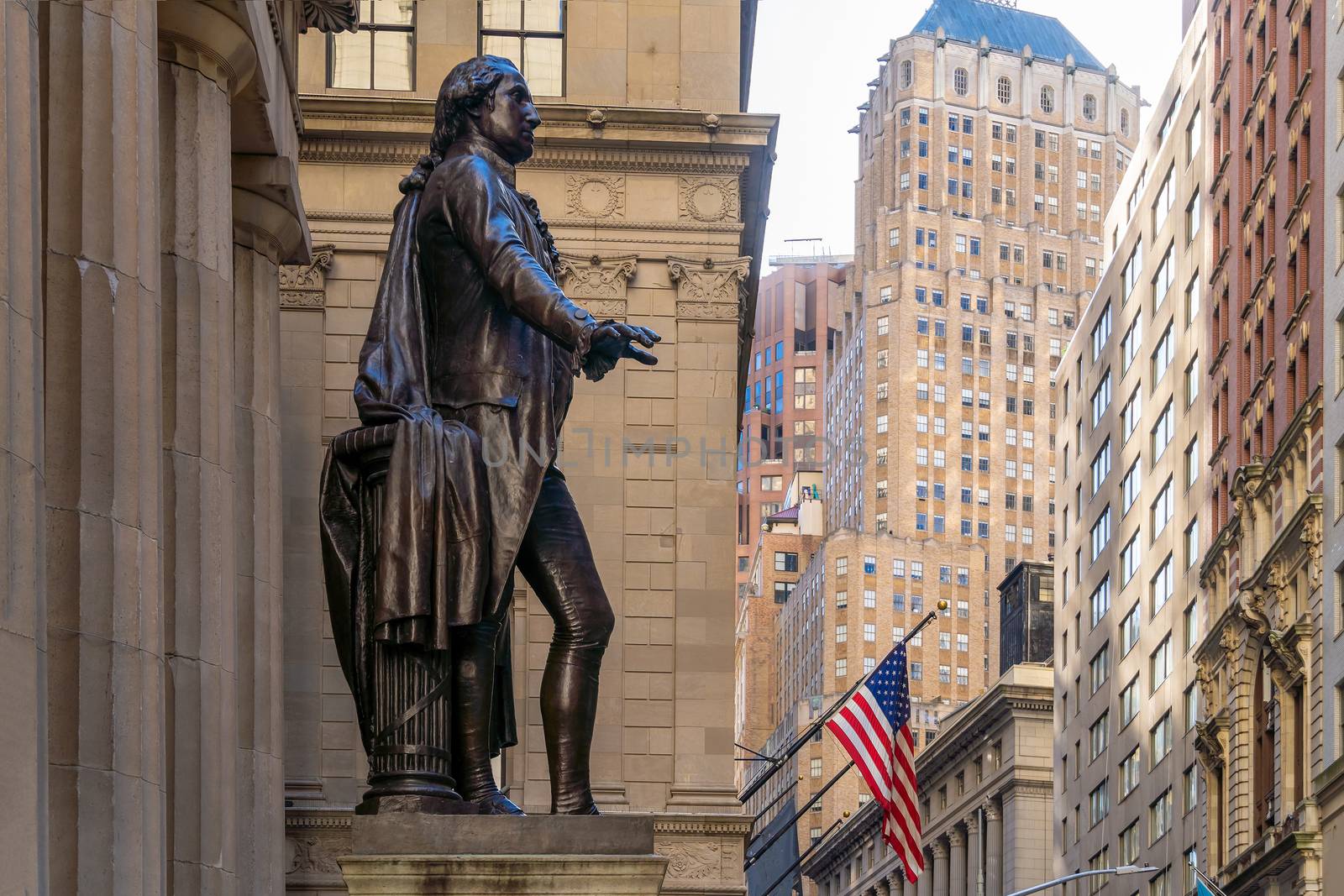 Wall Street  in Manhattan Finance district and Washington statue in the foreground