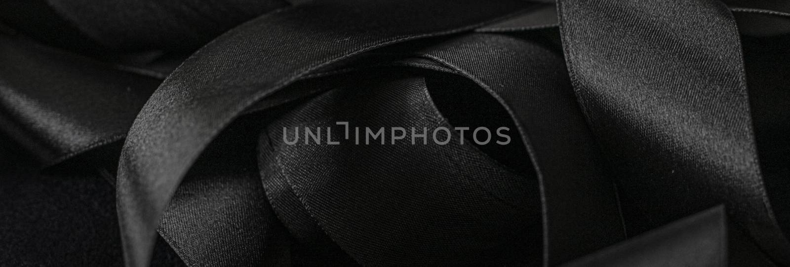 Black silk ribbon as background, abstract and luxury brand designs