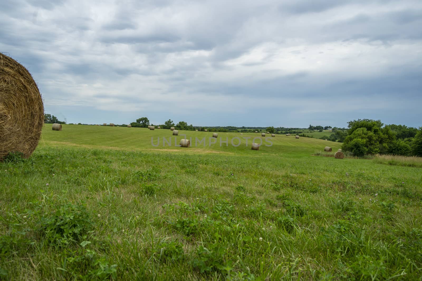 Beautiful landscape with straw bales in end of summer