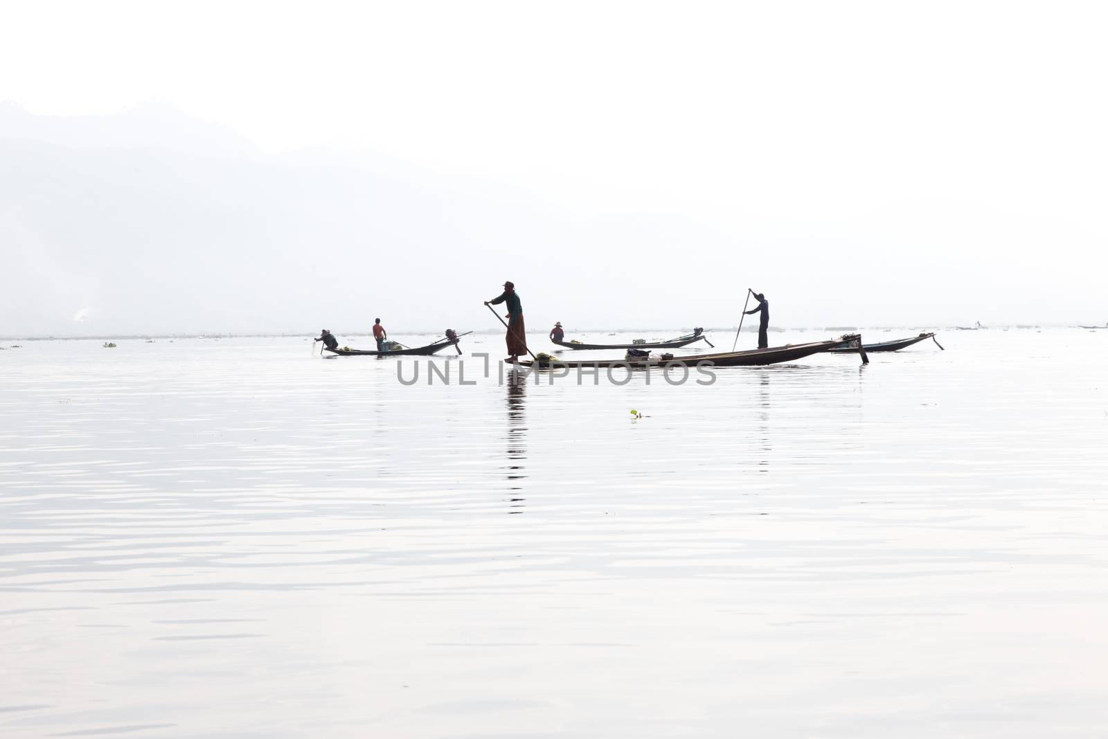 Inle Lake, Myanmar 12/16/2015 traditional Intha fisherman rowing with one leg . High quality photo