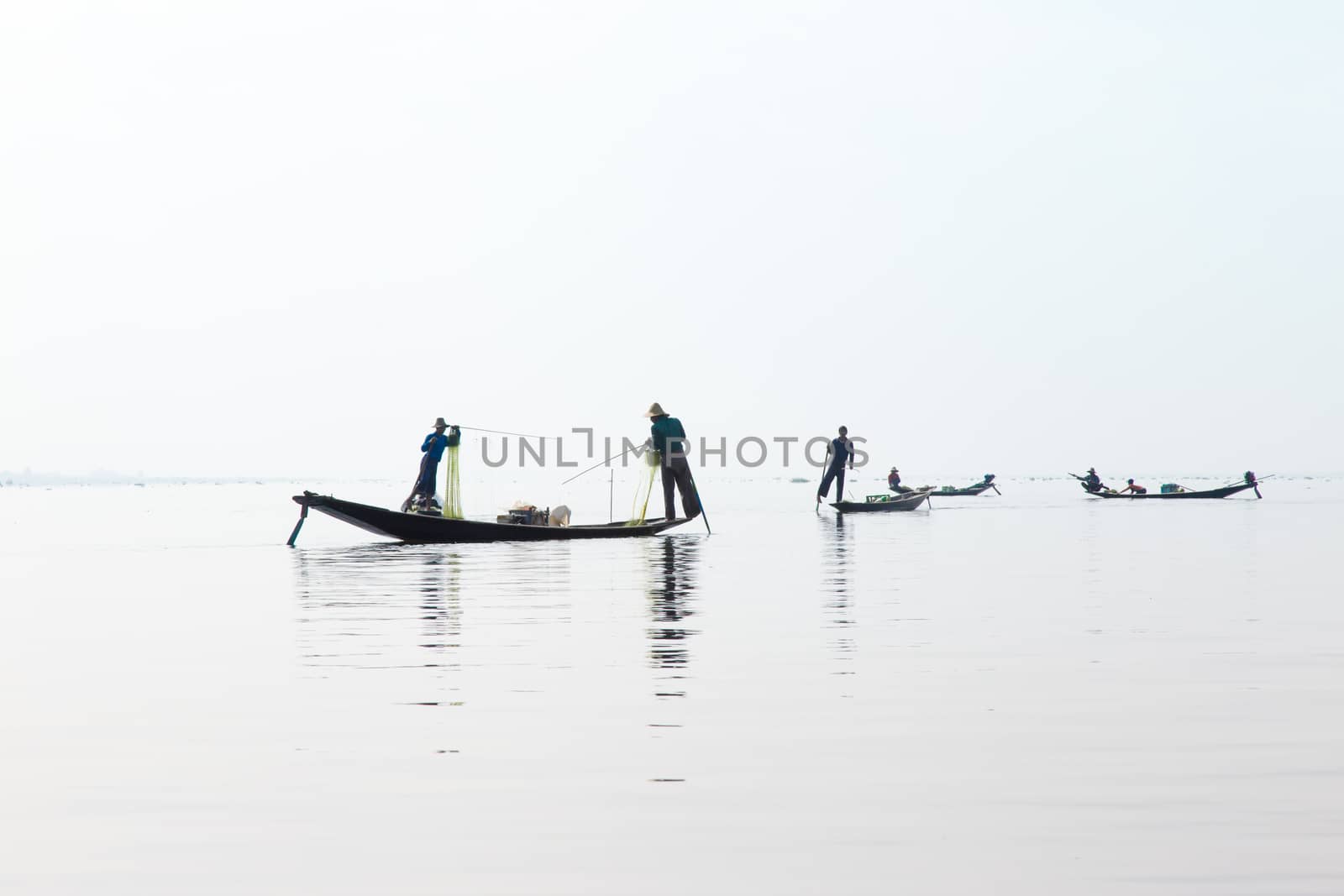 Inle Lake, Myanmar 12/16/2015 traditional Intha fisherman rowing with one leg . High quality photo