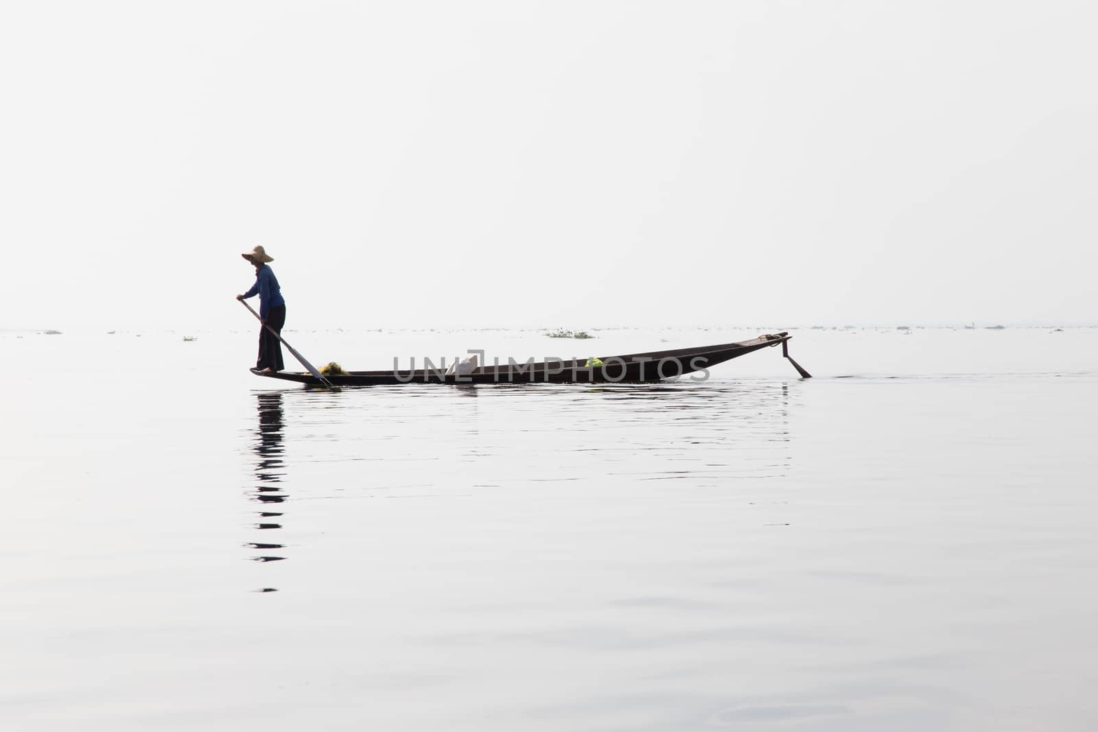 Inle Lake, Myanmar 12/16/2015 traditional Intha fisherman rowing with one leg . High quality photo