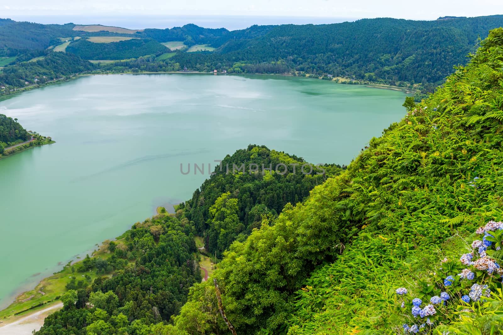 View of the Lake Furnas (Lagoa das Furnas) on Sao Miguel Island, Azores, Portugal from the Pico do Ferro scenic viewpoint. Tranquil scene of the lake in a volcanic crater
