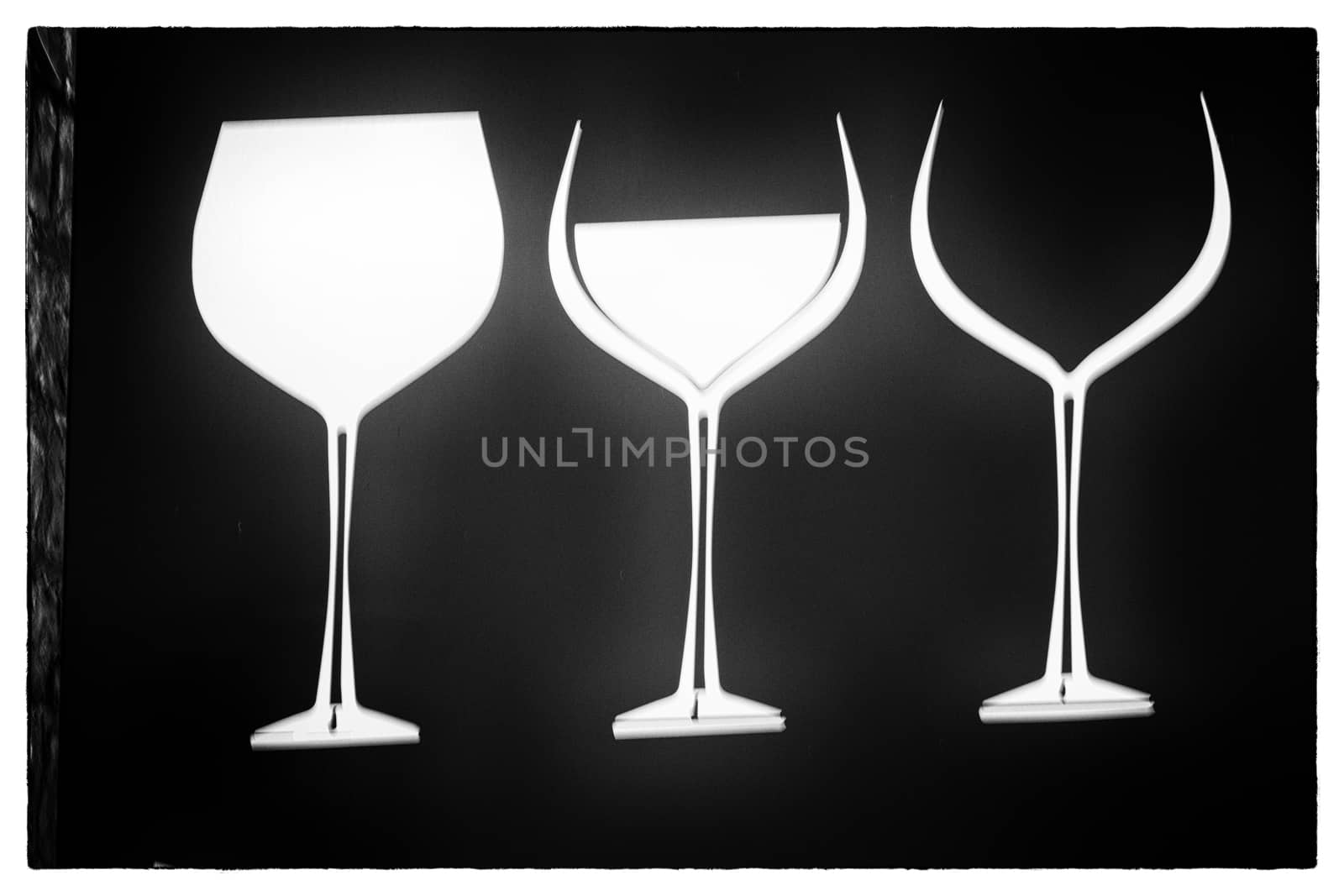 Three glasses of wine on a black background. by paddythegolfer