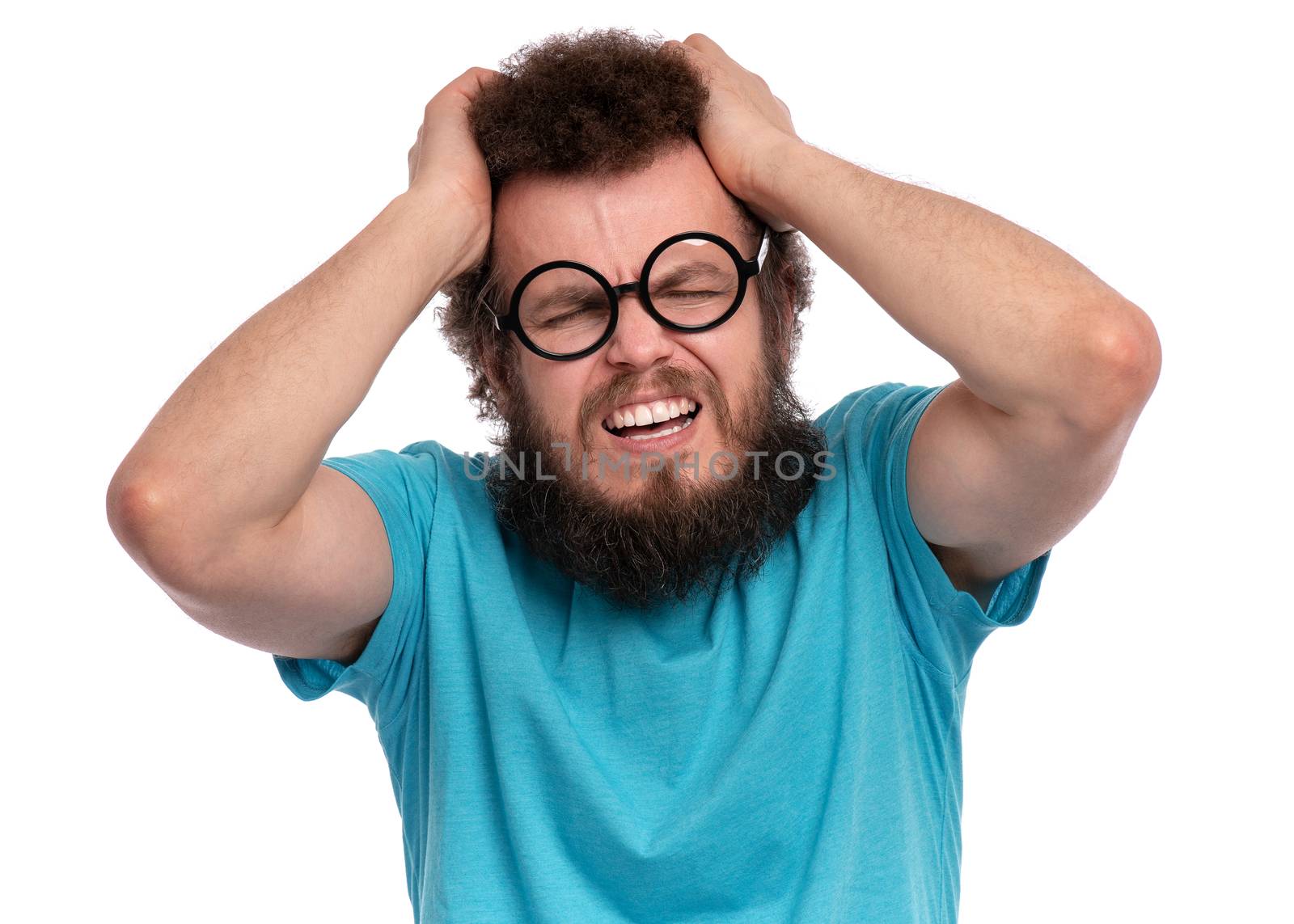 Crazy bearded man has headache by fotostok_pdv