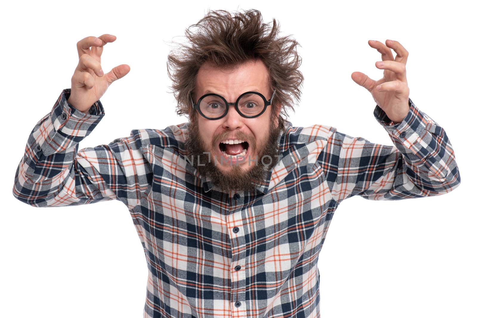 Crazy angry Man with funny Haircut in Eyeglasses. Bearded Enraged furious guy in plaid shirt screaming in anger, isolated on white background. Emotions and signs concept.