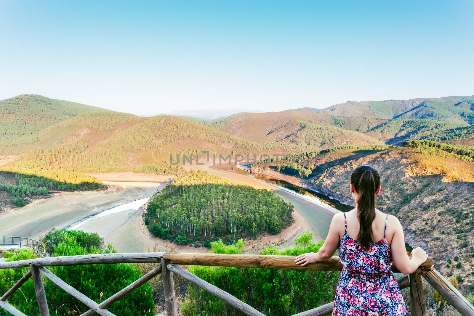 Woman looking the Meandro del Melero in Extremadura, Spain.