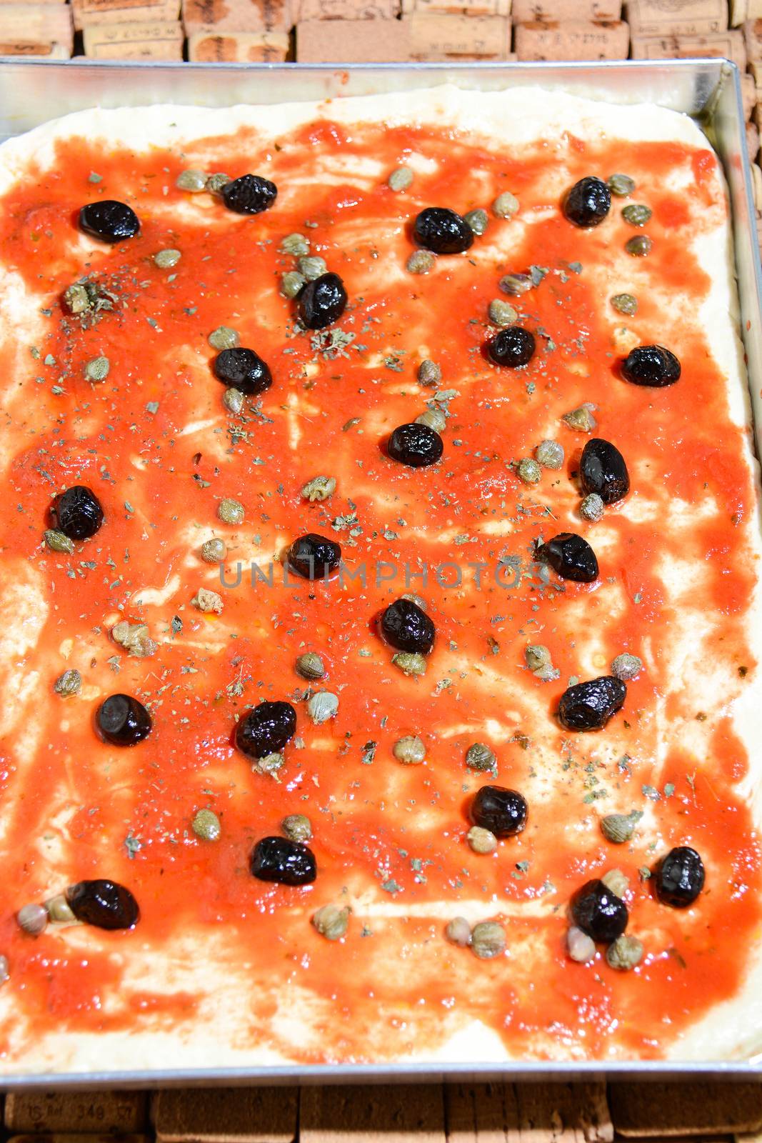 pizza stuffed with olives and Italian tomatoes