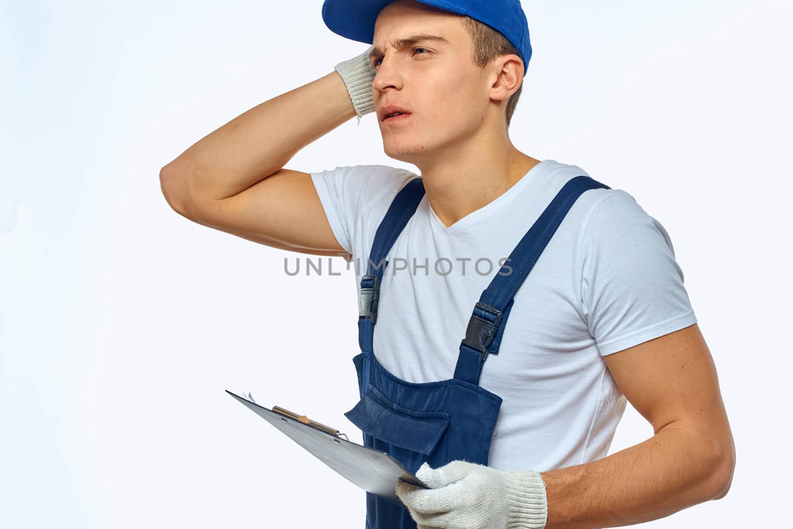 Working man in uniform documents delivery service courier by SHOTPRIME