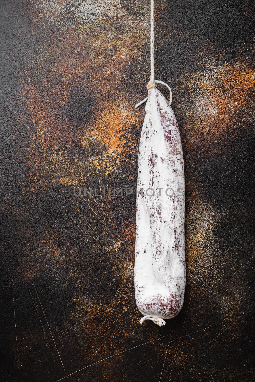 Longaniza wurst on dark background, flat lay with copy space.