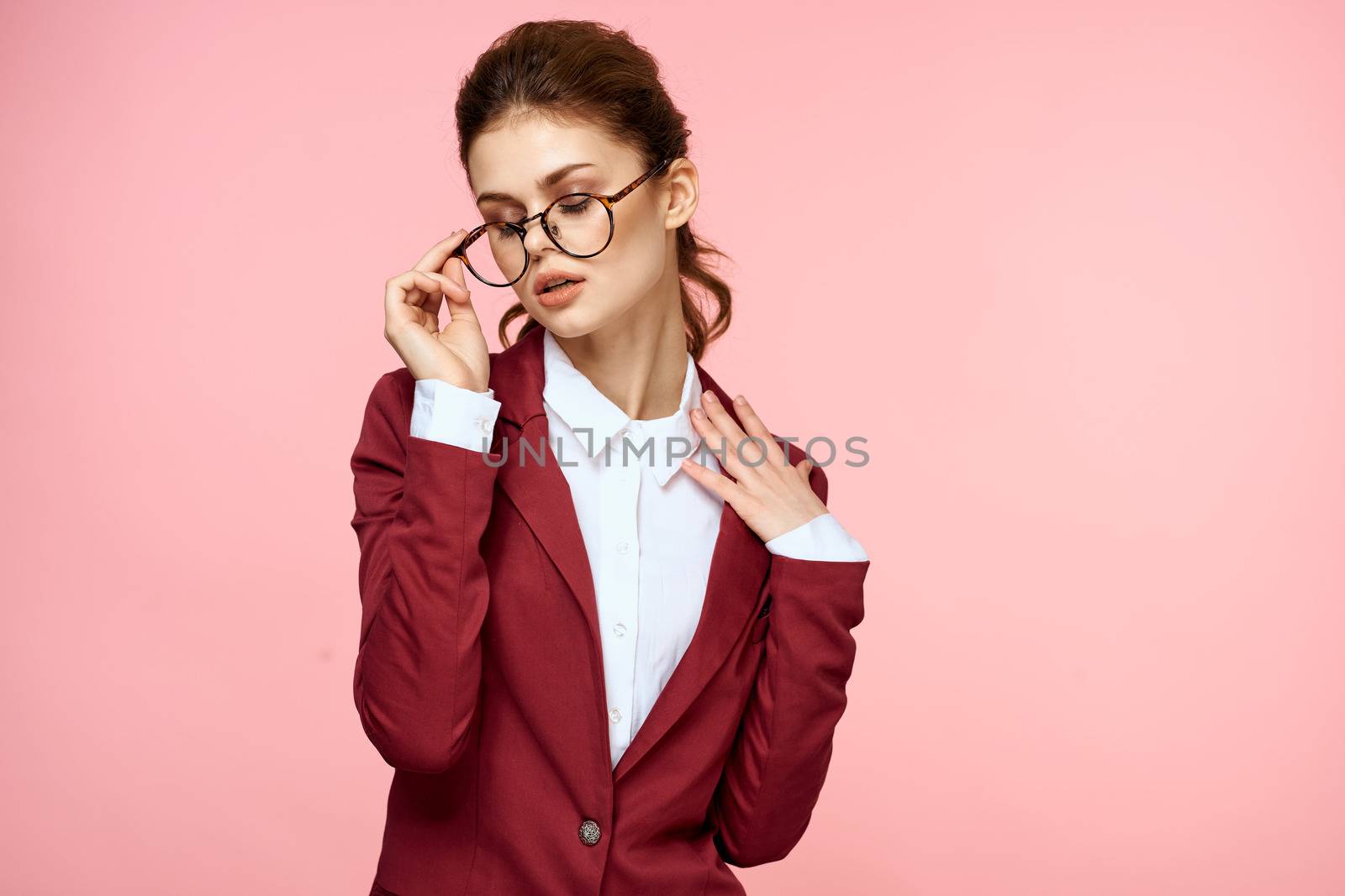 Business woman red jacket glasses executive lifestyle studio pink background by SHOTPRIME