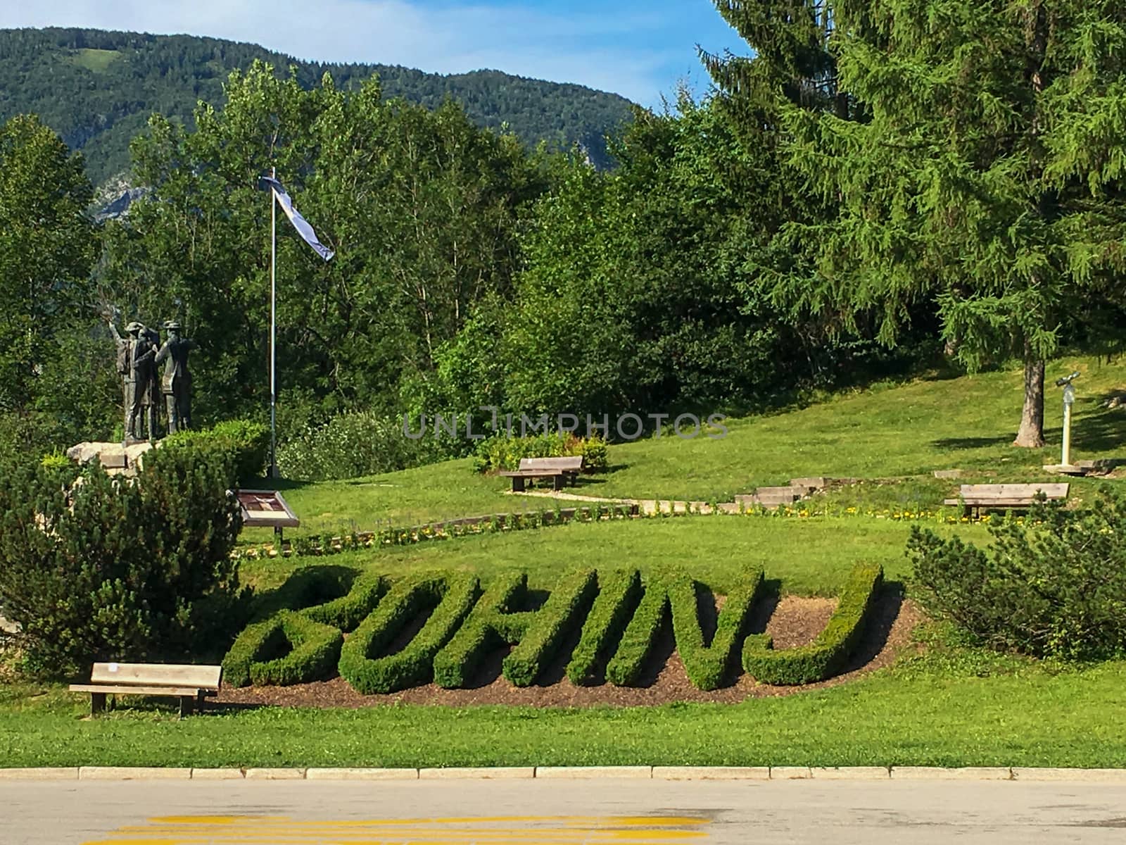 Bohinj, Slovenia, July 2017: Bohinj park with statue and hedges