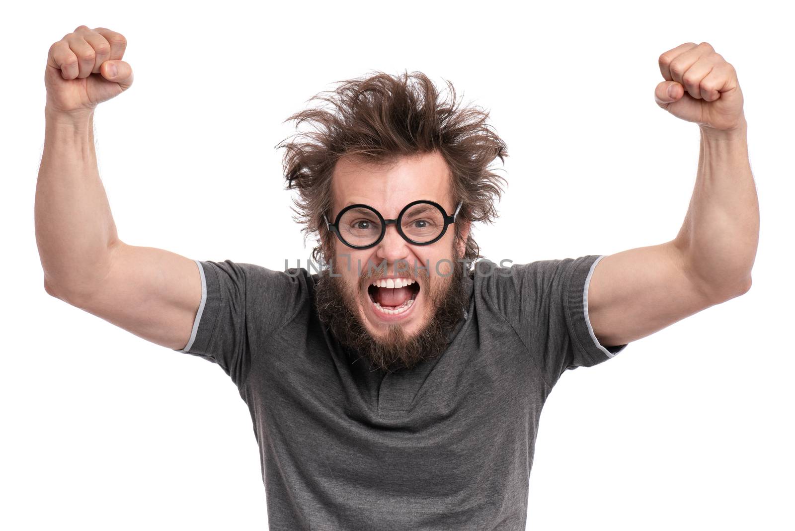 Happy winner. Crazy bearded Man with funny Haircut in eye Glasses celebrating his success. Guy make victory gesture, screaming and keeping mouth open, isolated on white background.