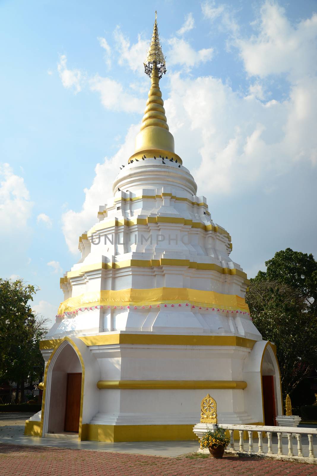 Phayao, Thailand  – 21 December, 2019 : Wat Nantaram is a Tai Yai (Shan-style) community temple in central Chiang Kham District, The brick-and-lime chedi of Tai Yai style