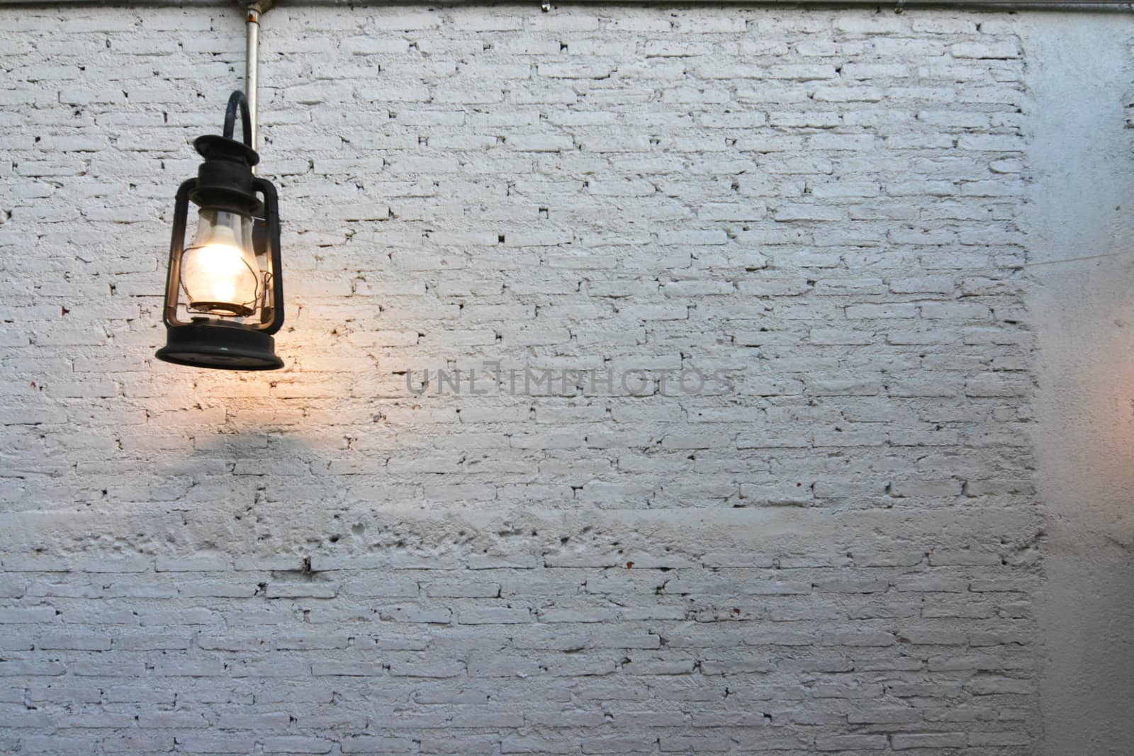 Lamp lantern on an old brick wall