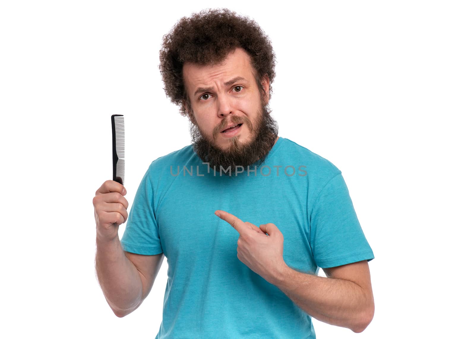 Crazy bearded man with hairbrush by fotostok_pdv