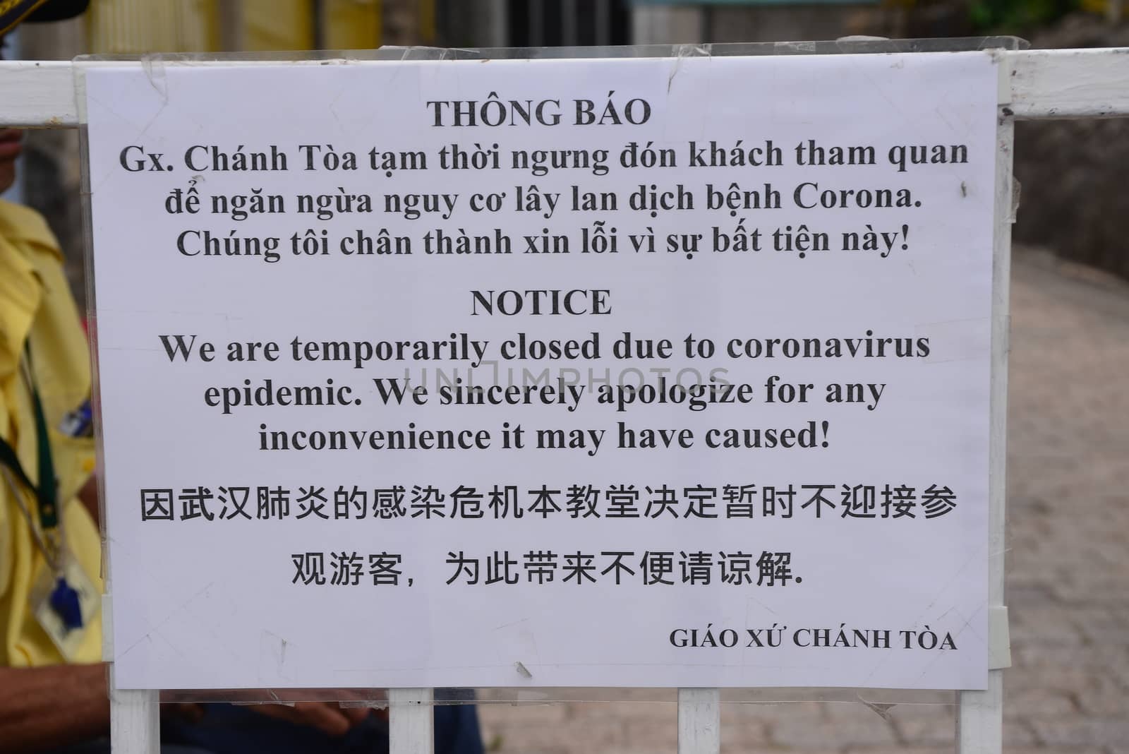 NHA TRANG, VIETNAM – 28 FEBRUARY 2020 : label alerts tourists about service closures due to Covid 19 virus at Christ the King Cathedral