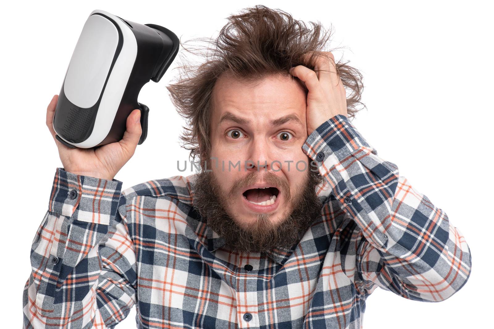 Crazy bearded Man in plaid shirt with funny Haircut wearing virtual reality helmet, isolated on white background. Portrait of funny man using VR goggles.