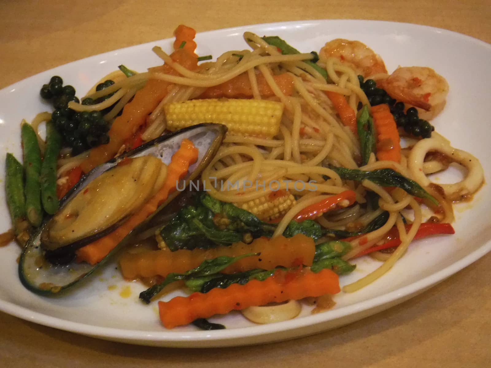 Spaghetti with Spicy Mixed Seafood, note  select focus with shallow depth of field