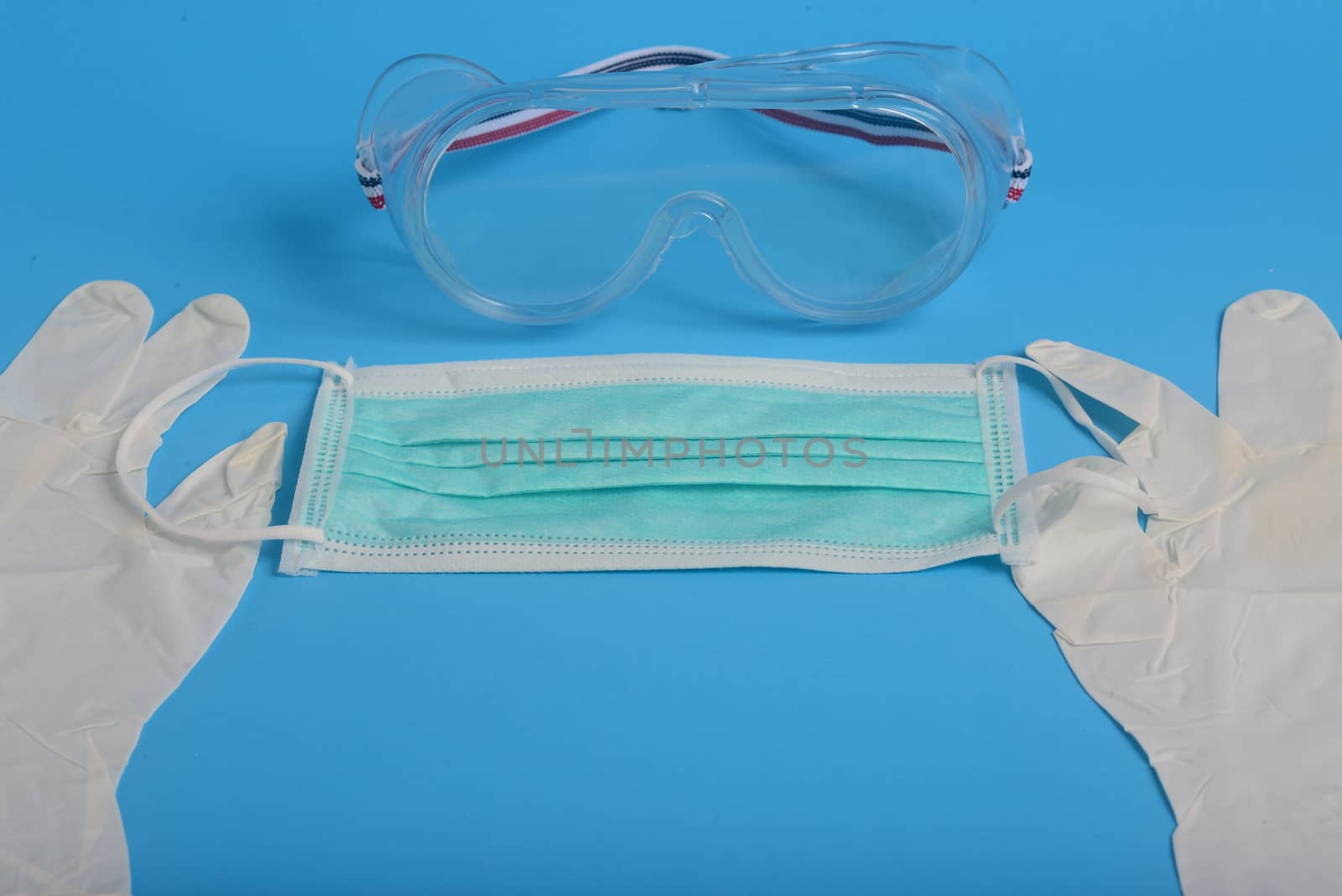 Disposable Hygienic Mask to cover the mouth and nose, transparent plastic laboratory glasses, glove latex hand examination, Protection concept covid-19 by ideation90