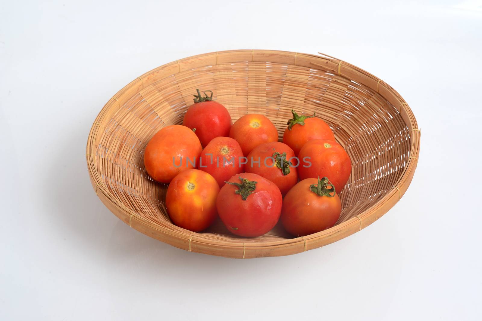 Tomato, (Solanum lycopersicum), flowering plant of the nightshade family (Solanaceae), cultivated extensively for its edible fruits. by ideation90