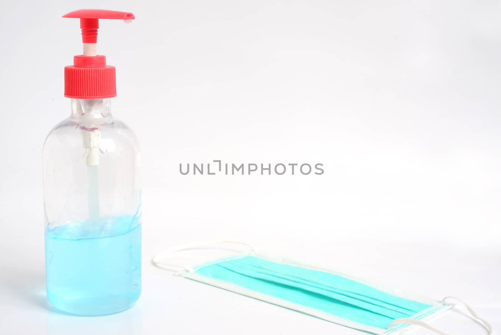 Alcohol Gel Hand Sanitizer and Disposable Hygienic Mask Suitable for protection against dust and germ . by ideation90