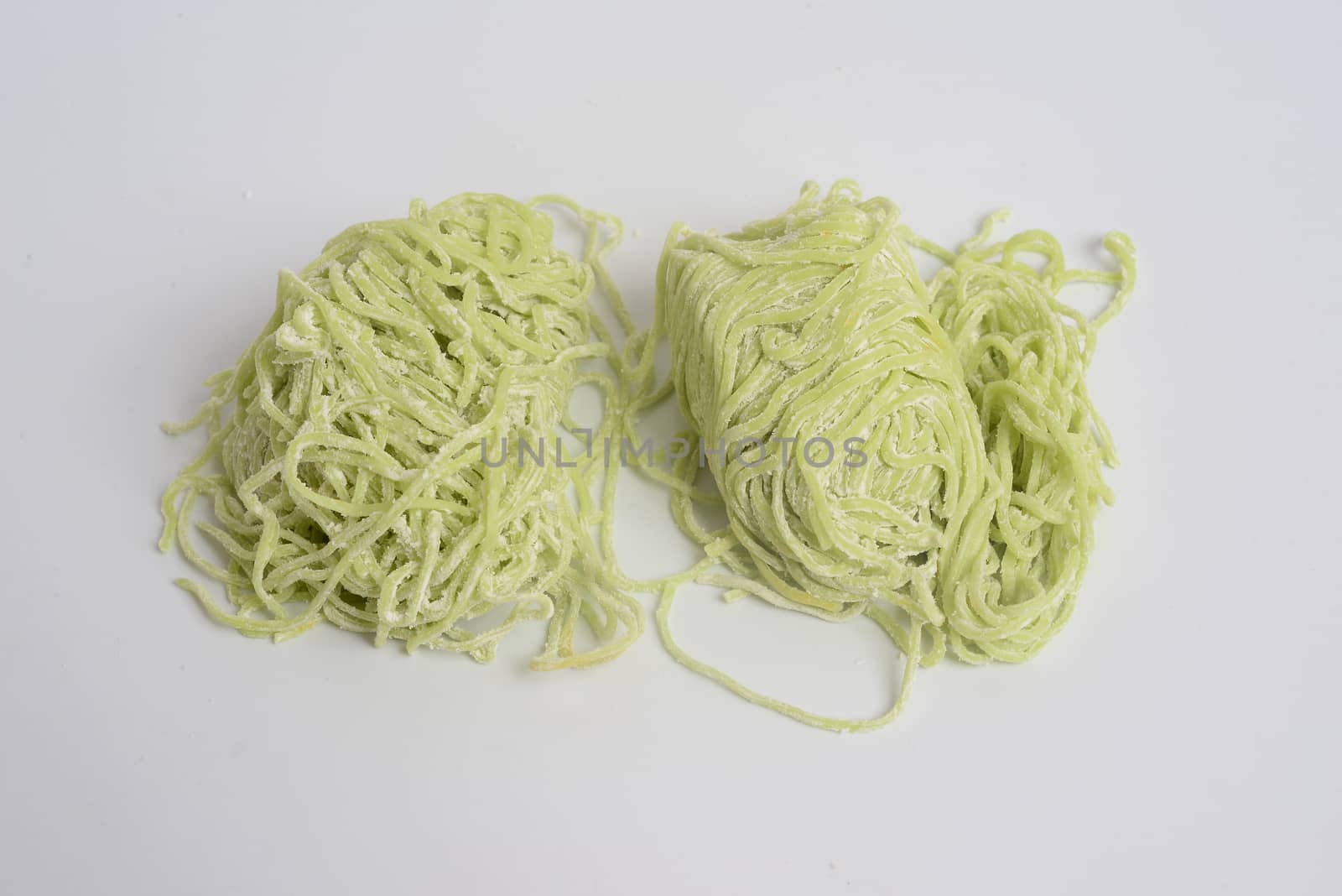 Jade noodle, vegetable noodles, green noodles on white background