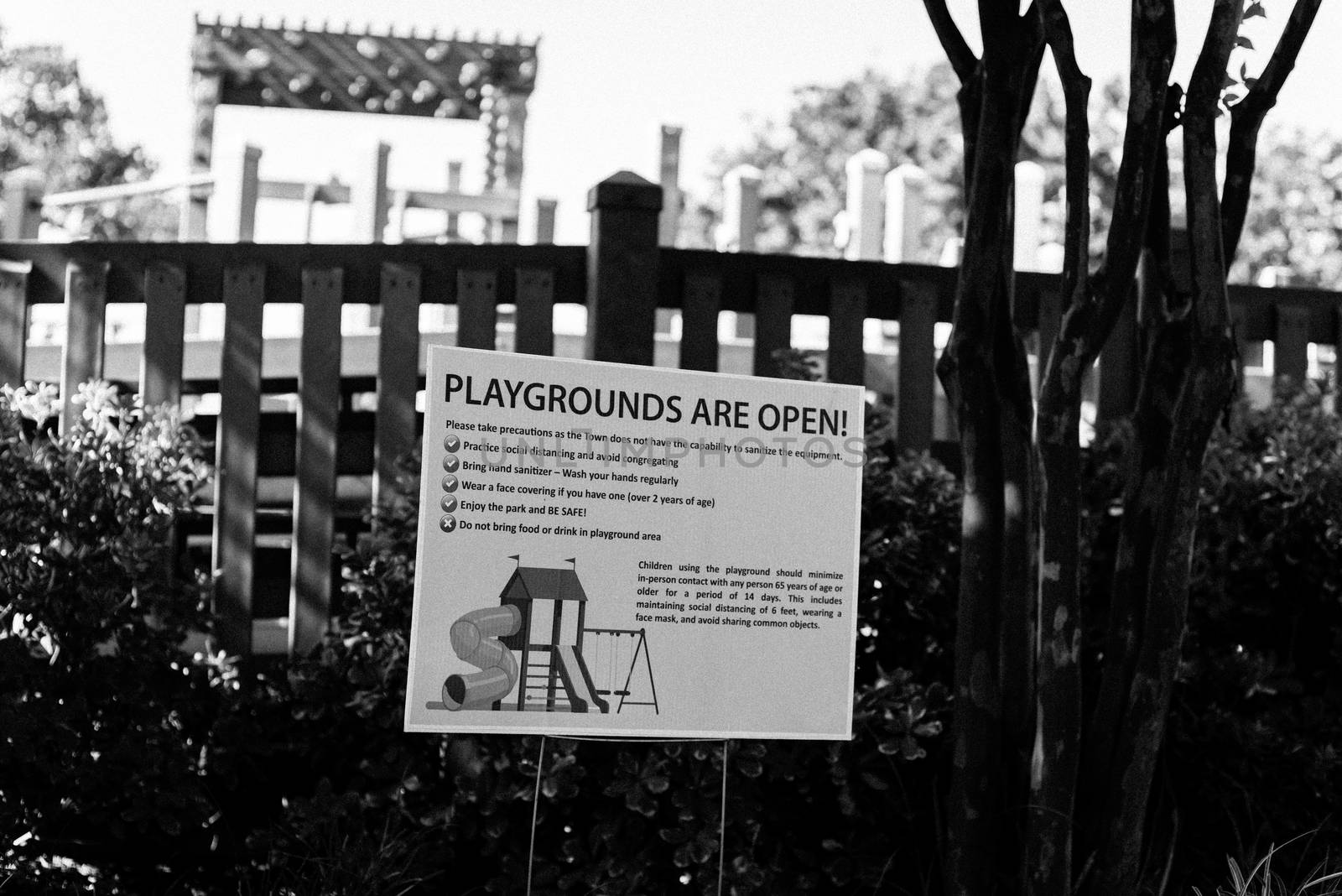 Vintage tone playgrounds are open sign at public recreational place near Dallas, Texas, America