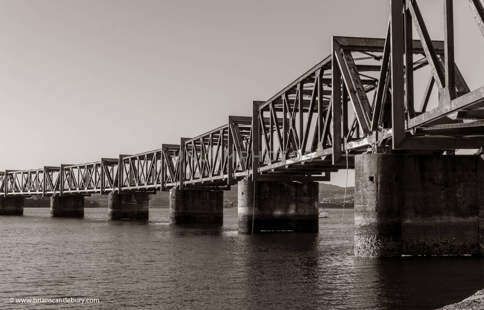 Old-fashioned steel truss railway bridge across Tauranga harbour,  New Zealand.