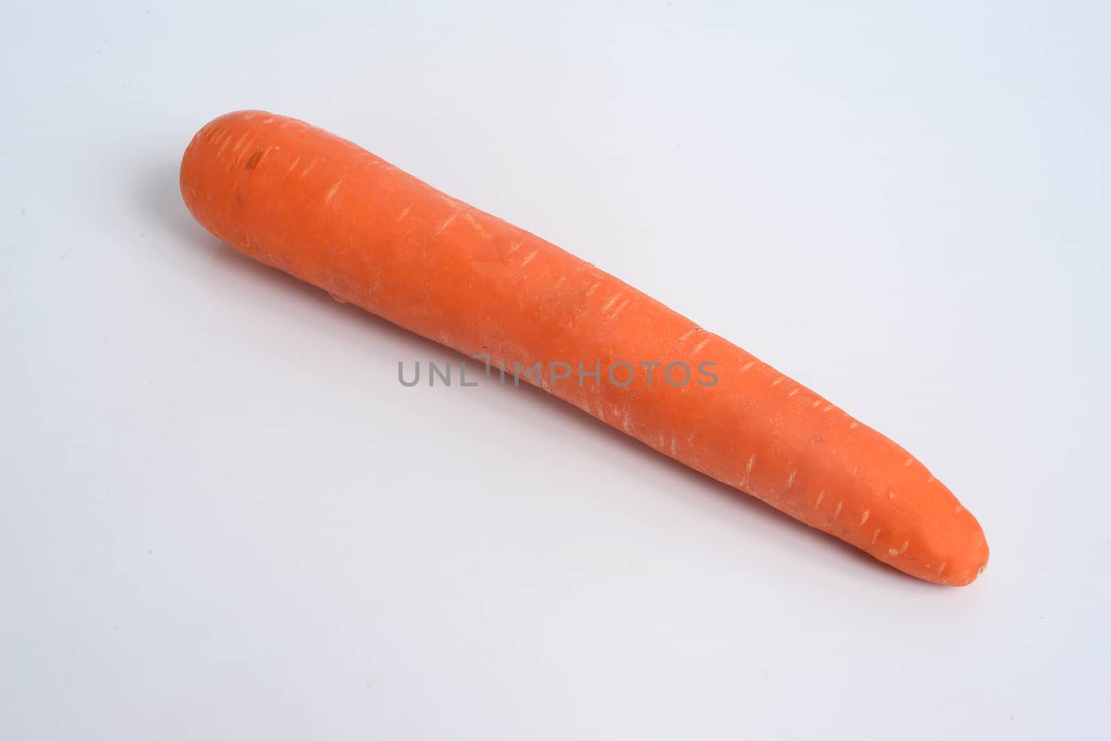 The carrot (Daucus carota subsp. sativus) is a root vegetable, usually orange in colour, with copy space for text