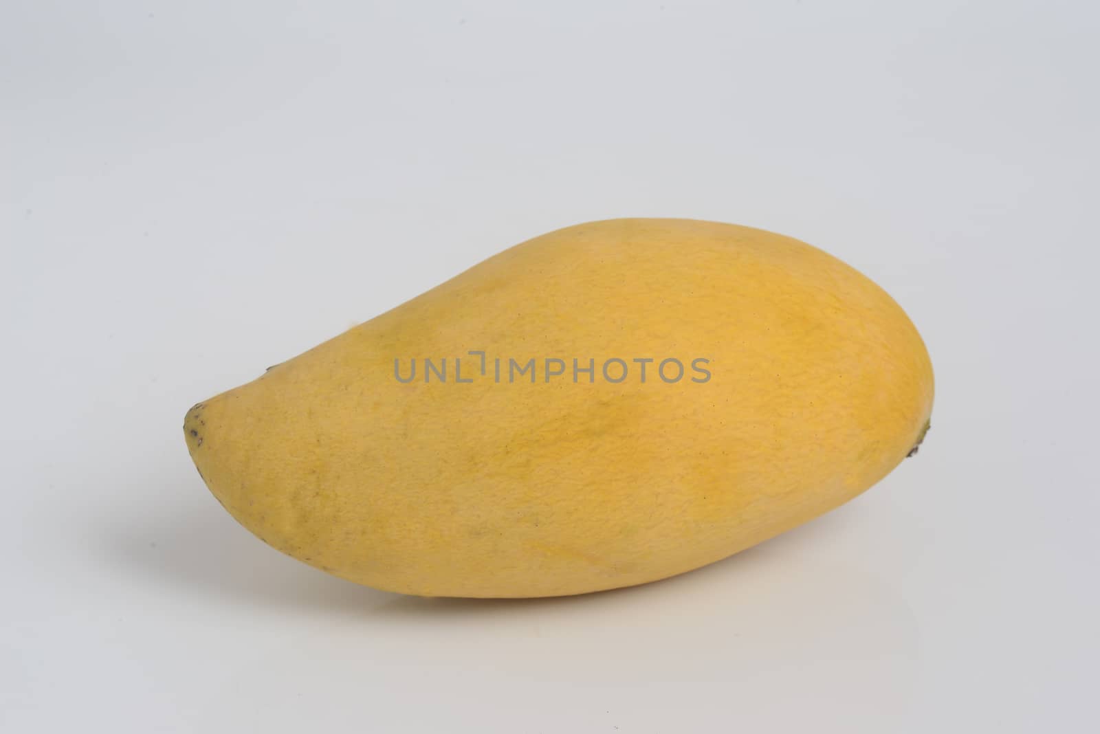yellow  mango on white background by ideation90