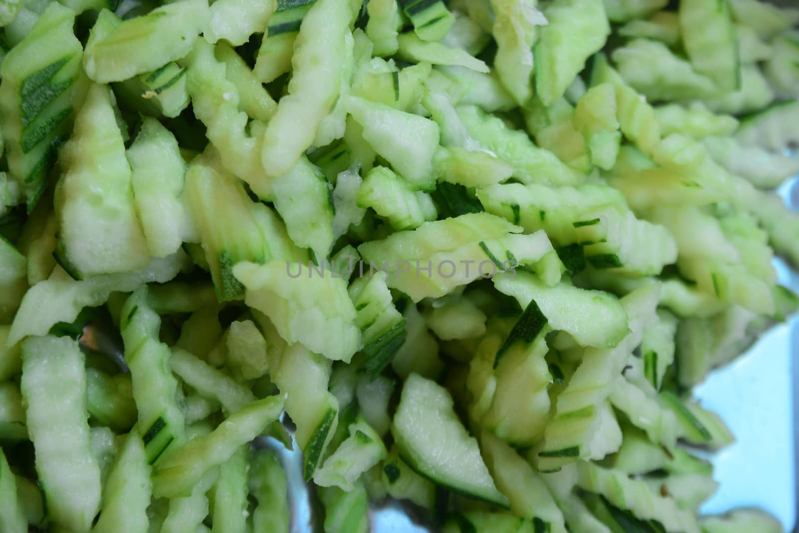 slice the cucumber, note  select focus with shallow depth of field

